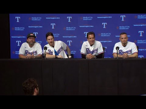 Creed band members hold a press conference in Texas Rangers gear at Game 3 of the ALCS