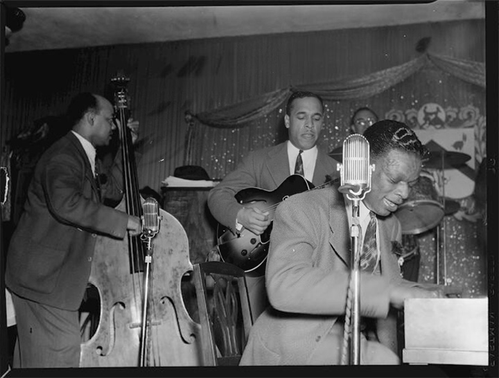 Wesley Prince (bass), Oscar Moore (guitar), and Nat King Cole, at The Café Zanzibar, 1946