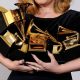 Adele holding Grammys