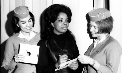 Photo of Mary Wells signing an autograph