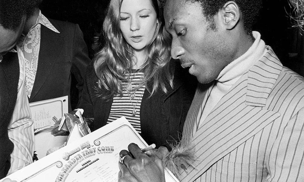 Jimmy Cliff signing The Harder They Come album, the soundtrack to one of the greatest films about reggae