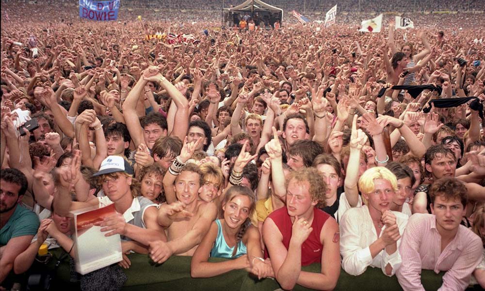 View of the cheering crowd in the audience at Live Aid