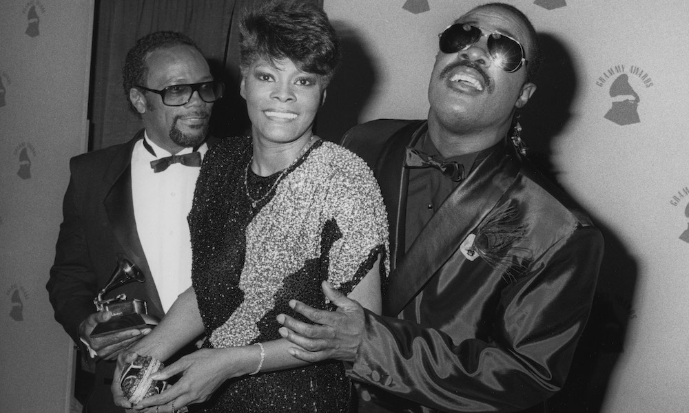Quincy Jones, Dionne Warwick, and Stevie Wonder with the 1986 Grammy Award for 'We Are The World.' Courtesy:Vinnie Zuffante/Michael Ochs Archives/Getty Image