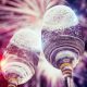 Best Classical Music for New Year - featured image of champagne glasses and fireworks