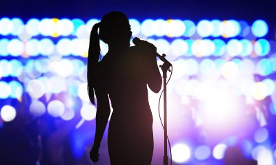 Karaoke singer singing songs into microphone