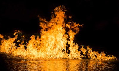 Songs about hell feature image, stock photo of fire on water