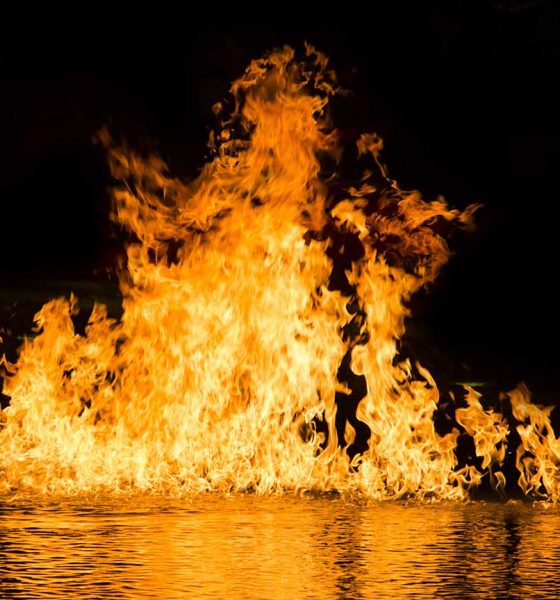 Songs about hell feature image, stock photo of fire on water