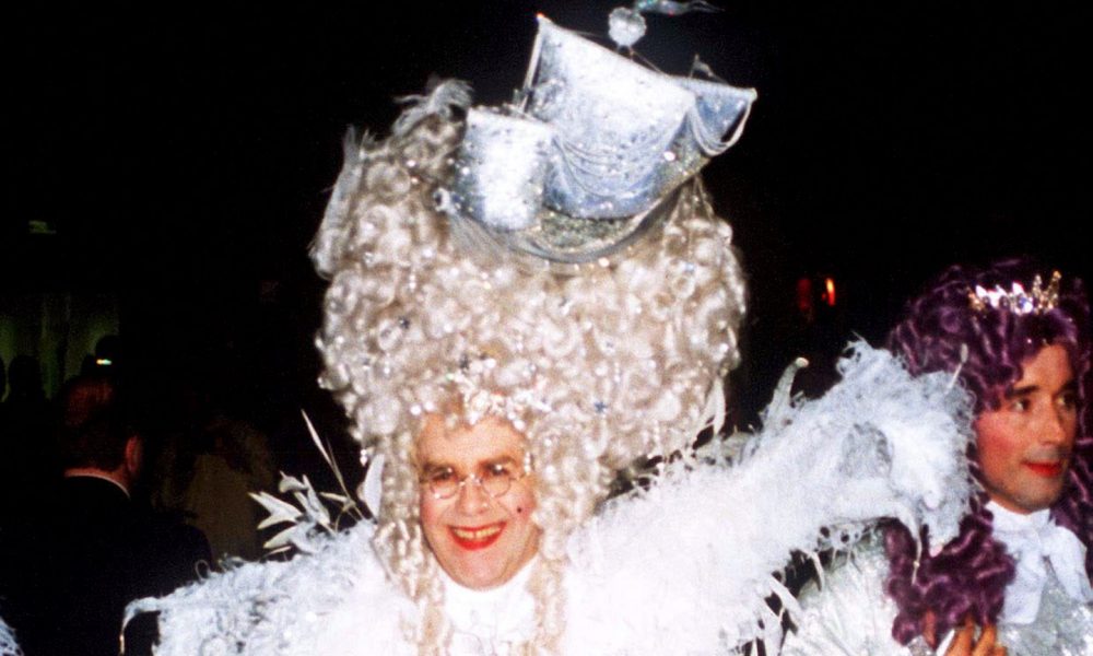 Elton John models the 'Louis XIV' look at his 50th birthday party in 1997. Photo: Dave Benett/Getty Images
